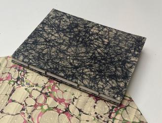 Encuadernación copta y plumier